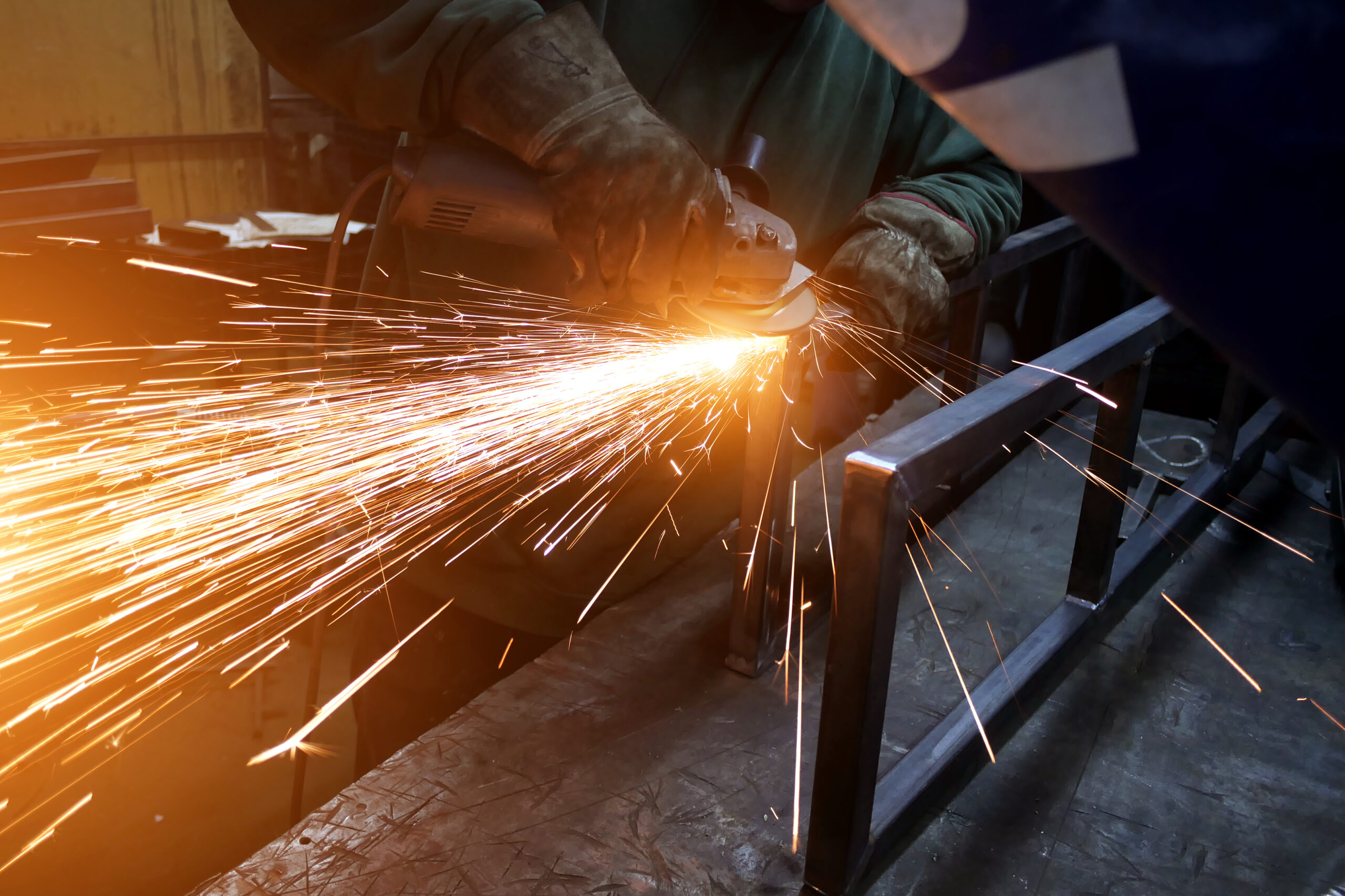 sparks from the work of the angle grinder close-up
